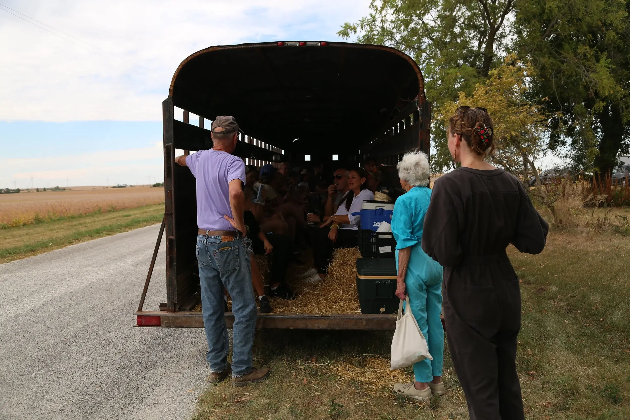 Livestock trailer with farm dinner guests on a tour of the farm
